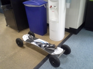 mountain board sitting next to water cooler